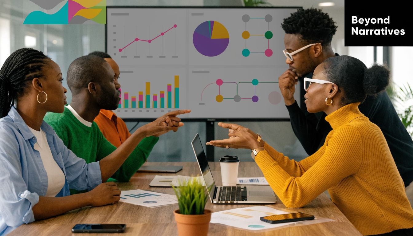 A diverse team of professionals collaborating around a conference table during a strategy and data meeting.