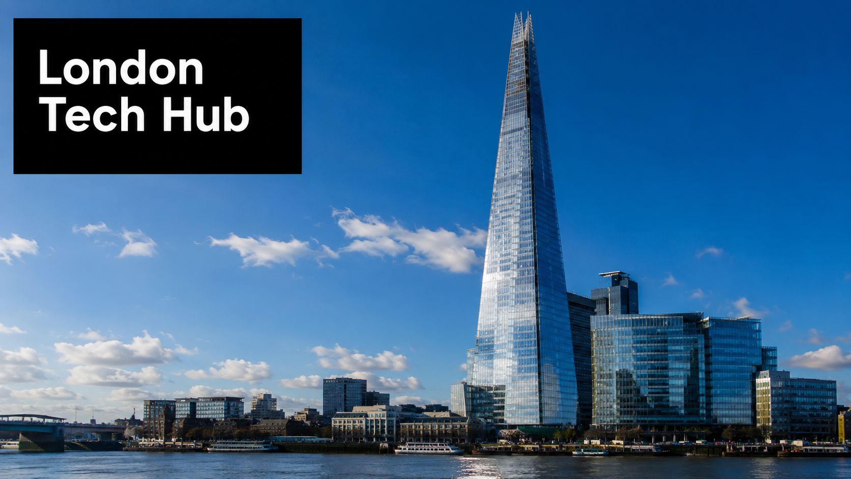 The Shard skyscraper standing tall against a blue sky above the River Thames in central London.